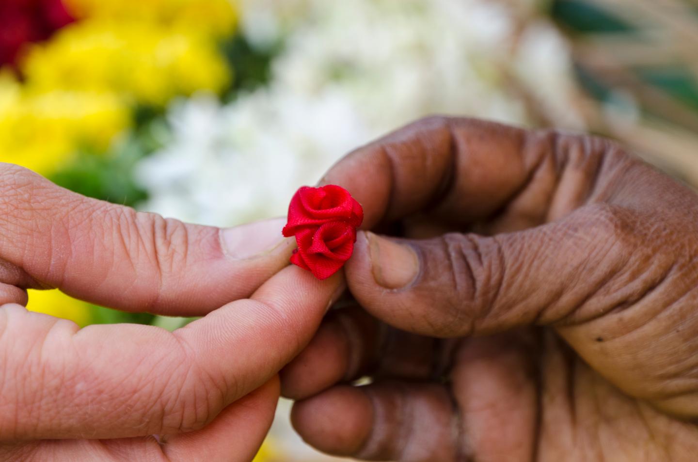 Little artificial flower given to a tourist for gift as a