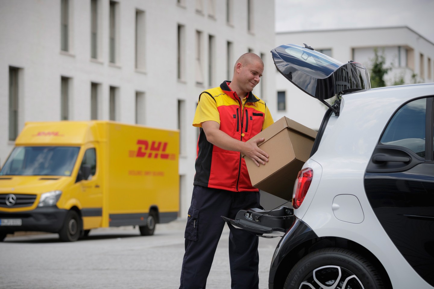 Daimler's Smart cars will be able to take deliveries from DHL.