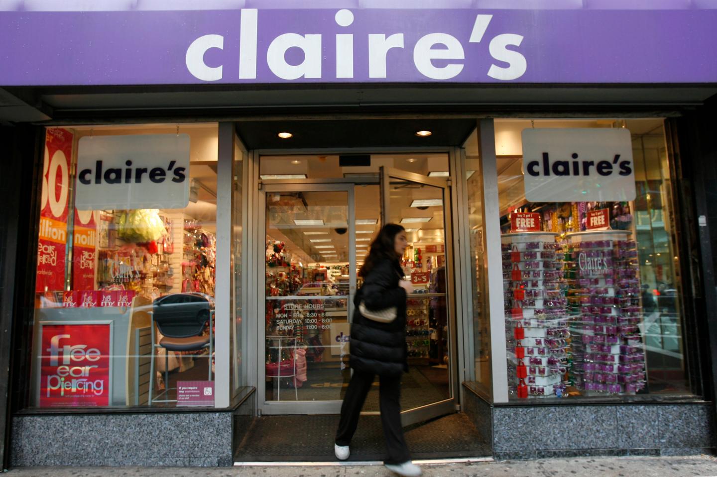 A woman exits a Claire's store on Friday, December 1, 2006 i