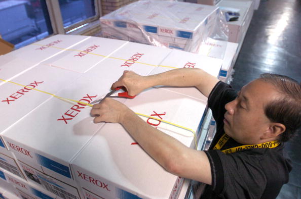 Lap Yeung, an employee for Xerox Corp., opens a palette of p