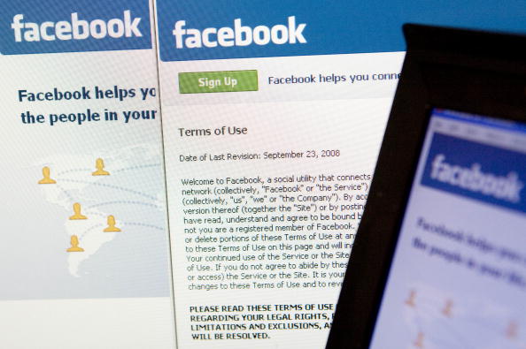 The Facebook terms of use and homepage are displayed on a co