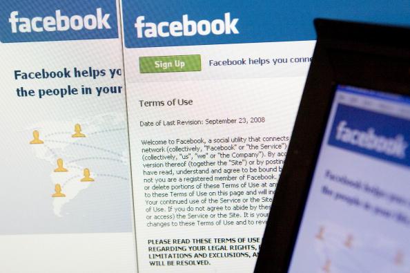 The Facebook terms of use and homepage are displayed on a co