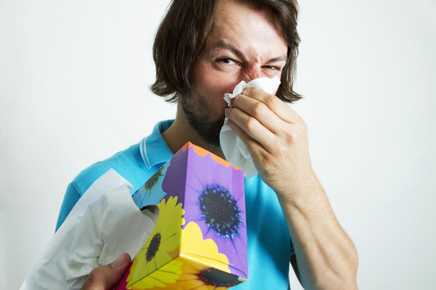 Man blowing his nose