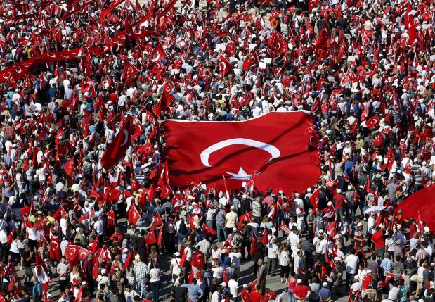 Supporters of various political parties gather in Istanbul's Taksim Square
