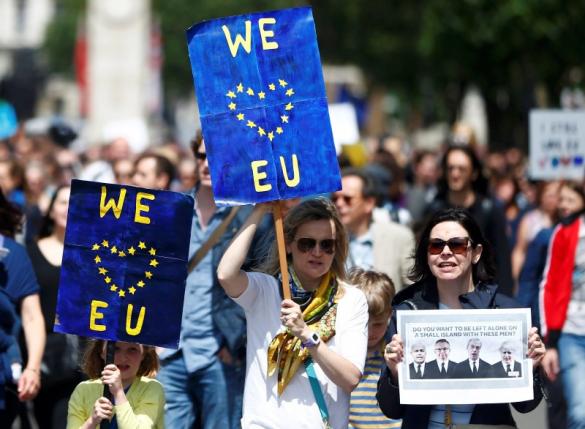 People hold banners during a demonstration against Britain's decision to leave the European Union, in central London