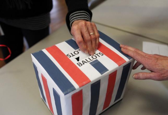 A voter casts a ballot during the Harpswell republican town caucus at the Old Orr's Island School House in Harpswell