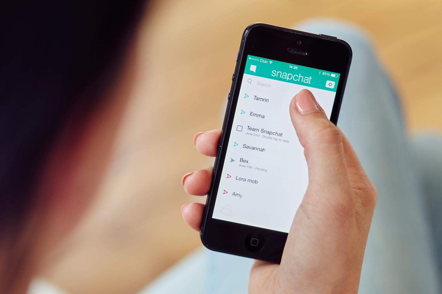 Person using Snapchat App on iPhone