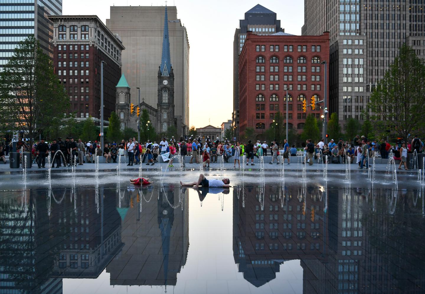 CLEVELAND, OH - JULY 20: A man lies in the fountain at Public S