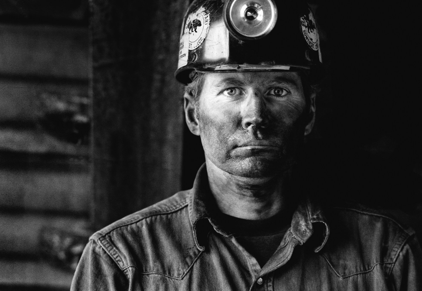 Coal miner covered in coal dust