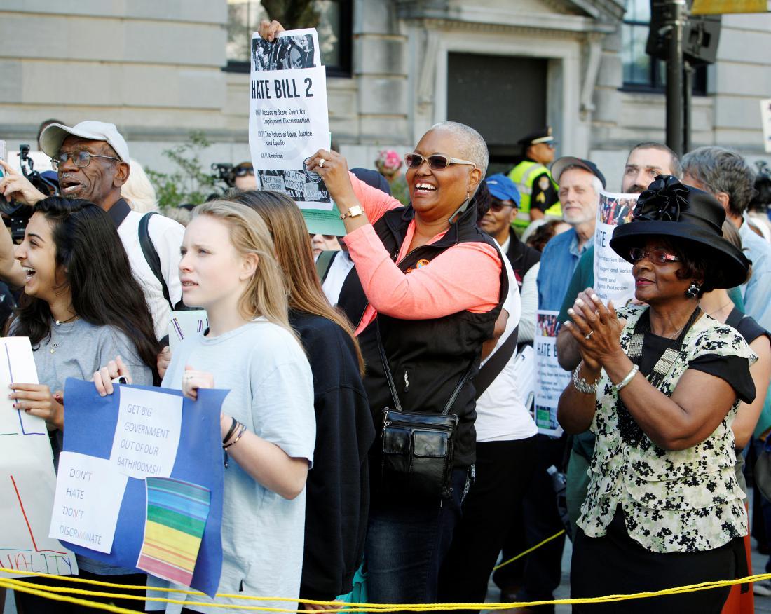 Members of the black community join a diverse crowd of protesters opposing North Carolina's HB2 "bathroom law" during a demonstration outside the state legislature in Raleigh