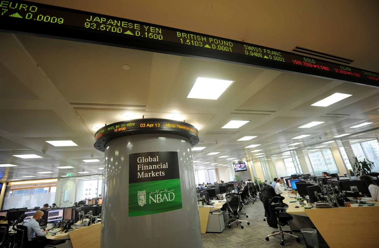 Employees are seen in the offices at the National Bank of Abu Dhabi headquarters