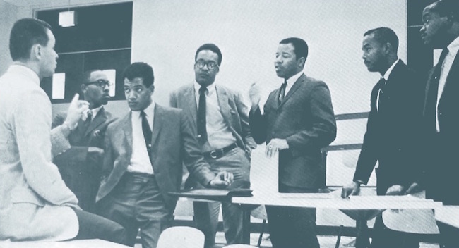 Six of IU’s seven inaugural class members in a 1968 meeting with Dr. L. Richard Oliker, left, administrative director of the MBA program in 1968. Fourth from left, Vernon Mason.