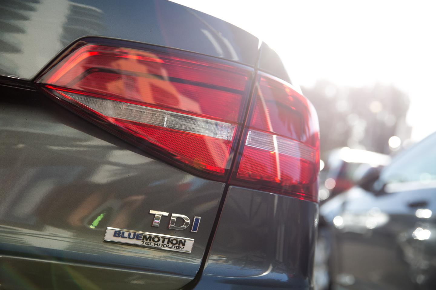 Used cars by German manufacturer Volkswagen are parked at a dealership in London.