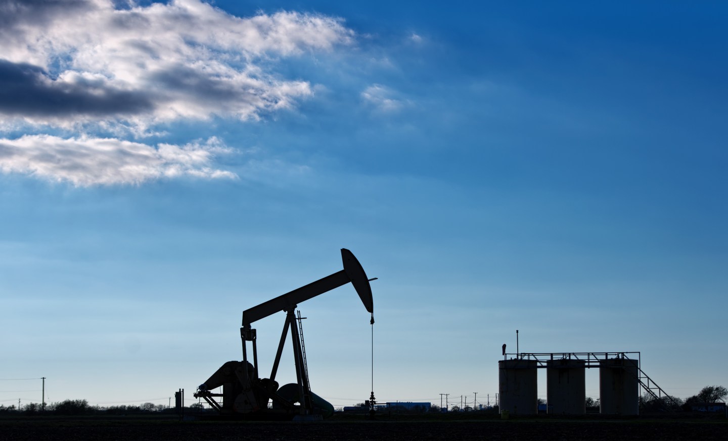 Views Of Tankers & Refineries As Oil Trades Near 12-Year Low