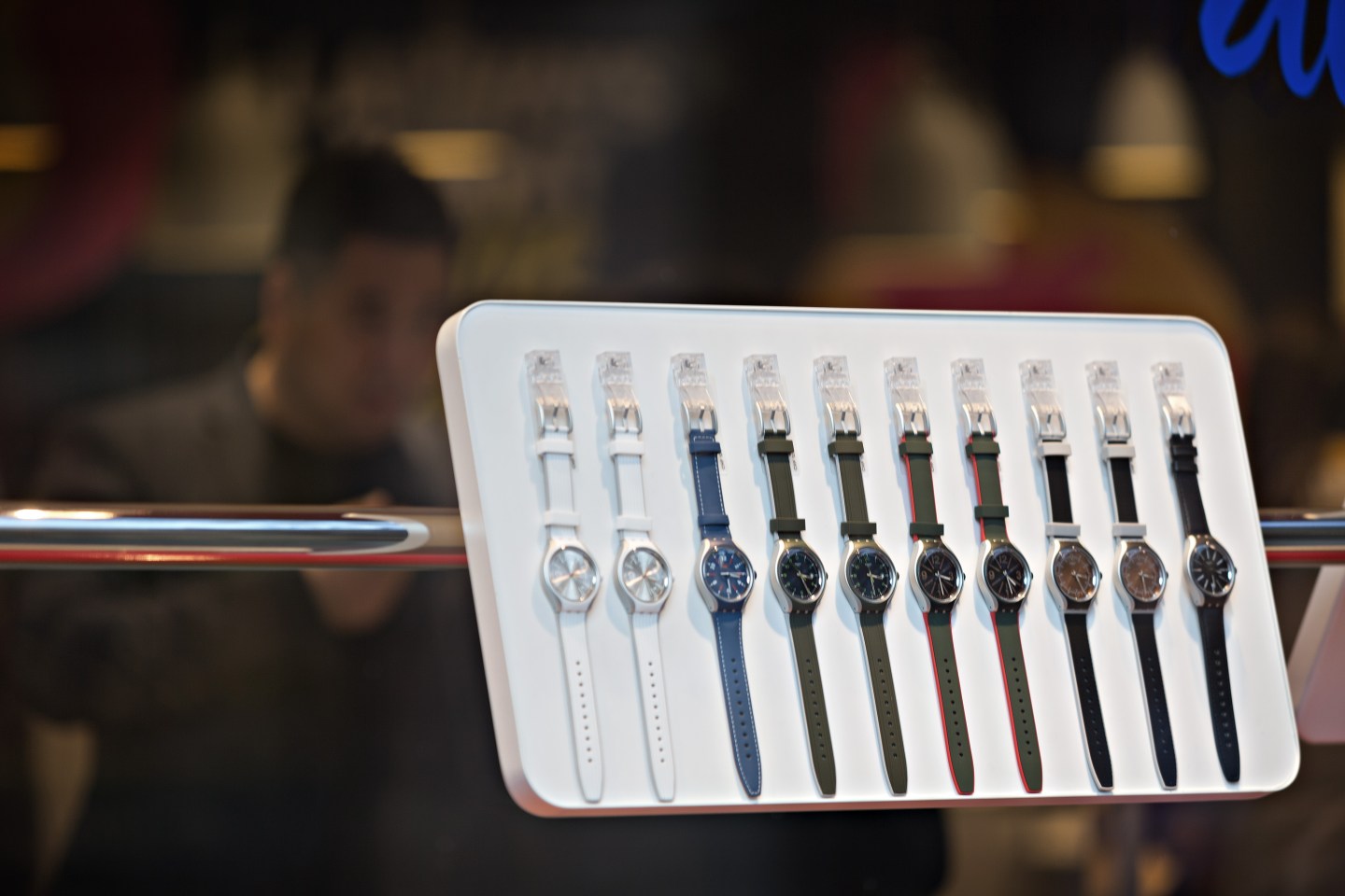 Wrist watches sit on display in the window of a Swatch store in Zurich