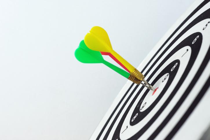 Three darts on dartboard