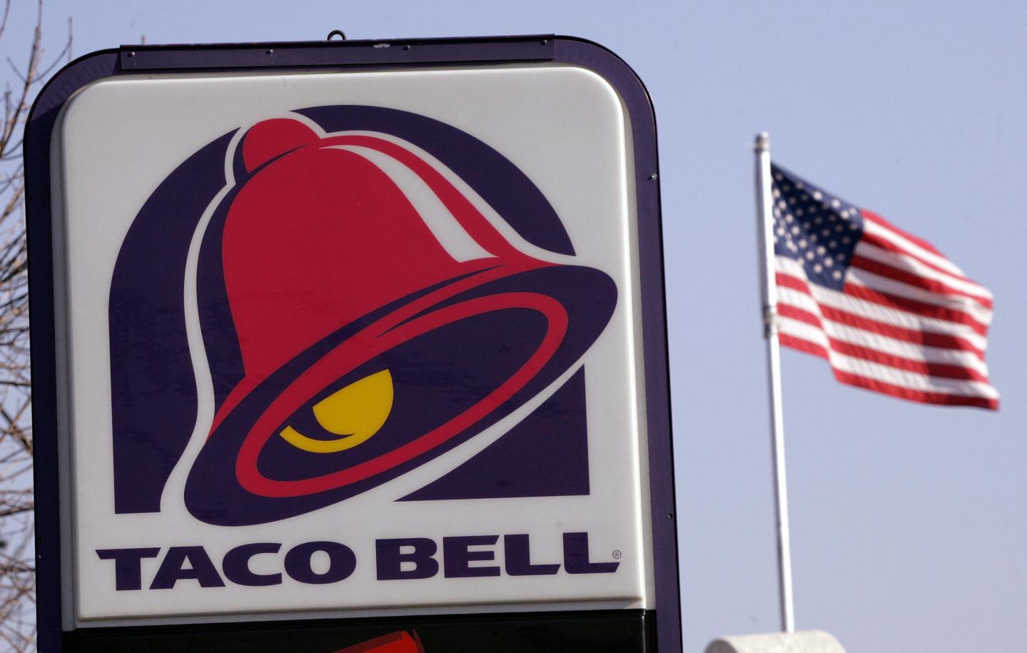 A United States flag flies next to a sig