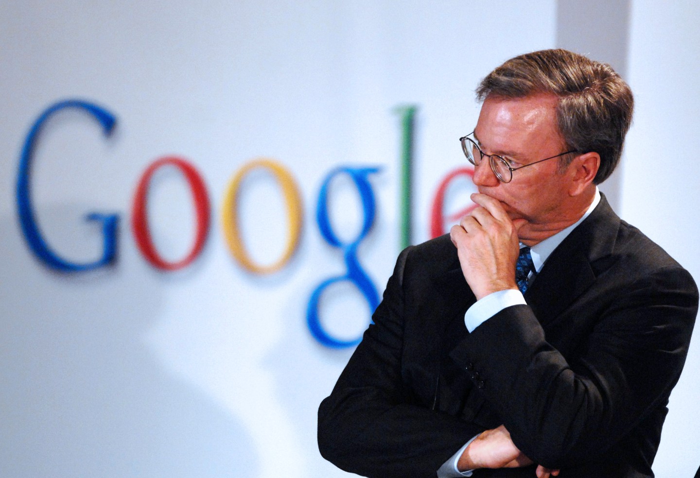Eric Schmidt, chief executive officer of Google Inc., listen