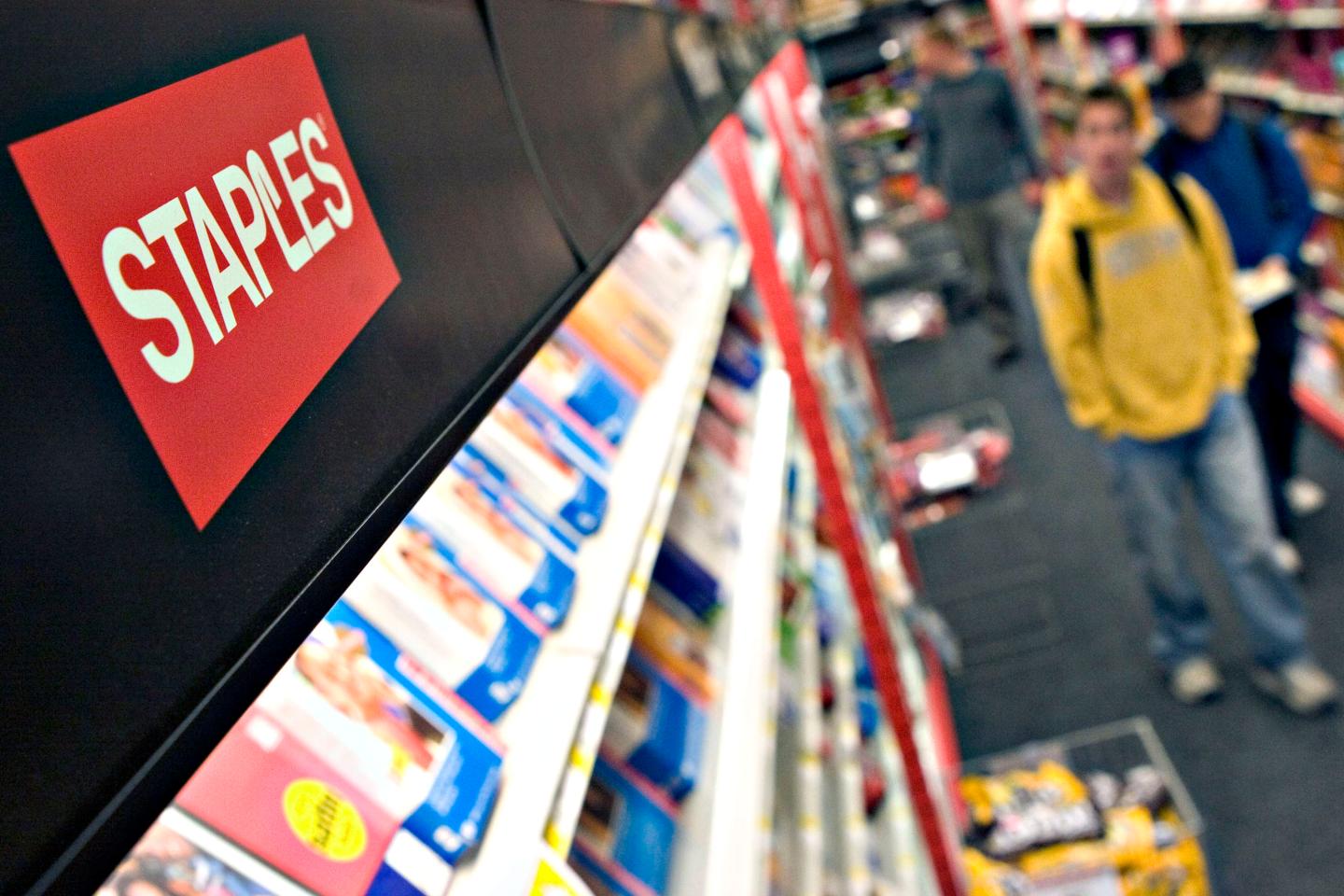 Customers shop inside a Staple's store in Allston, Massachus