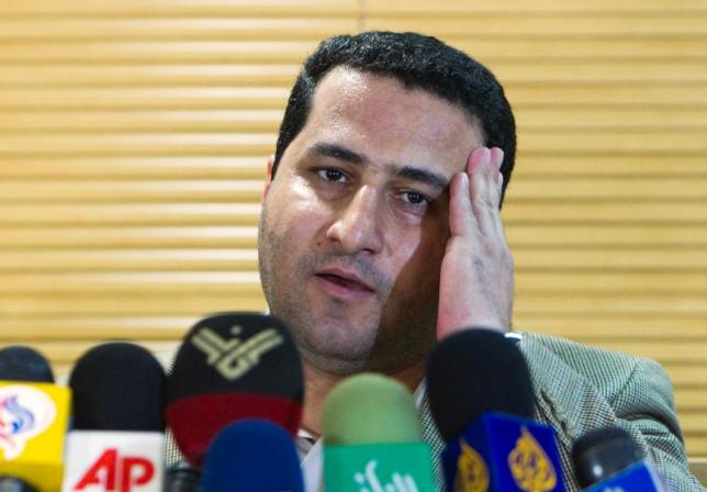 Iranian scientist Amiri speaks with journalists as he arrives at the Imam Khomini airport in Tehran