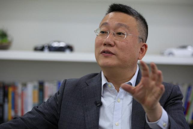 Freeman Shen, founder and CEO of WM Motor Technology Co., Ltd. speaks during an interview with Reuters at his office in shanghai