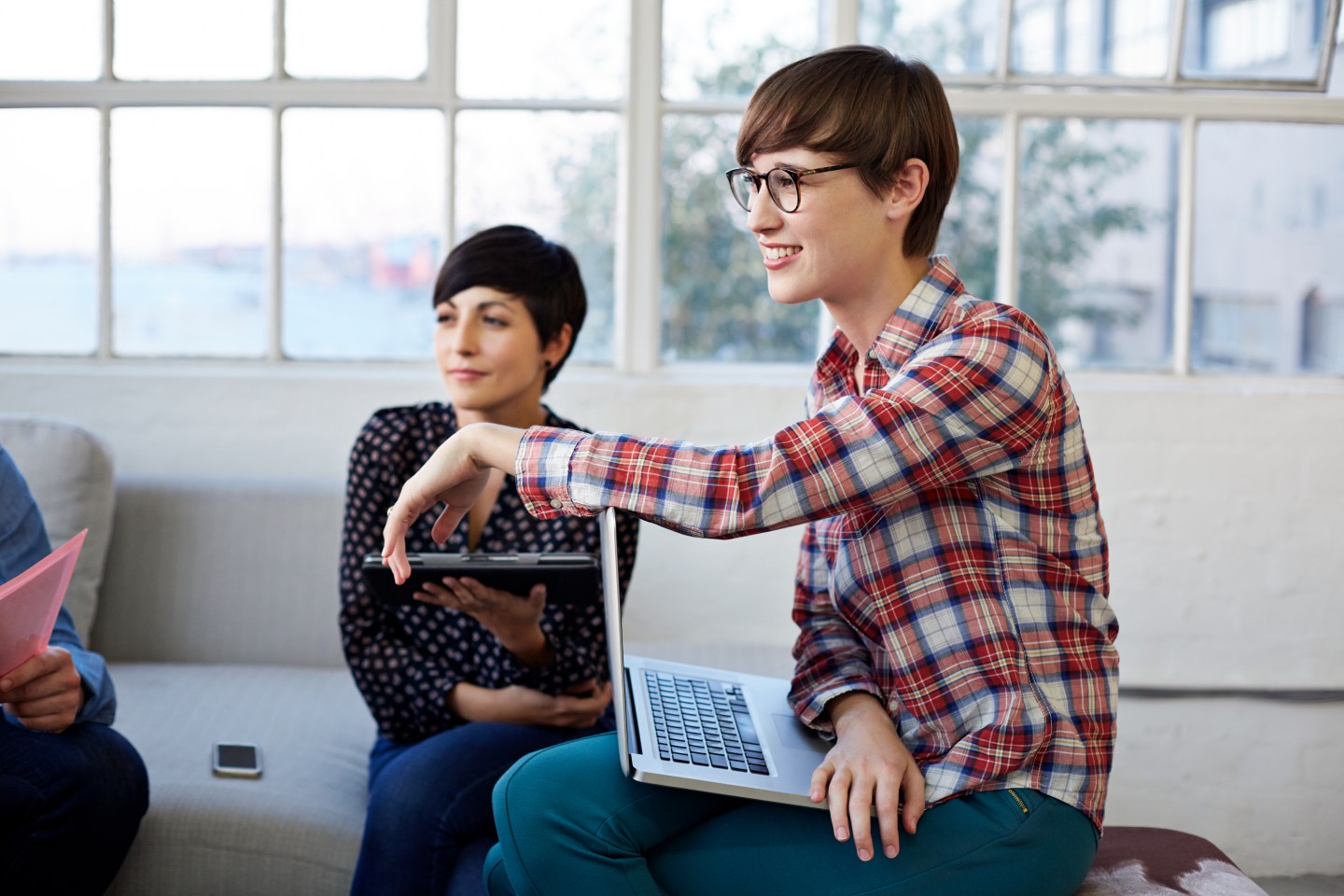 Creative businesswomen at meeting in couch