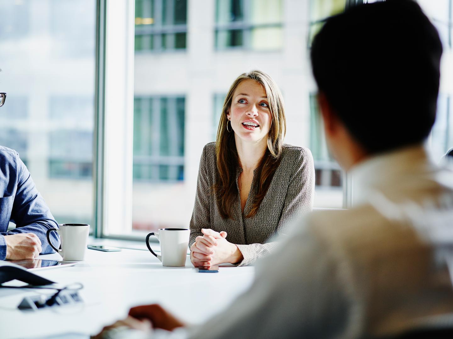Businesswoman leading project discussion in office