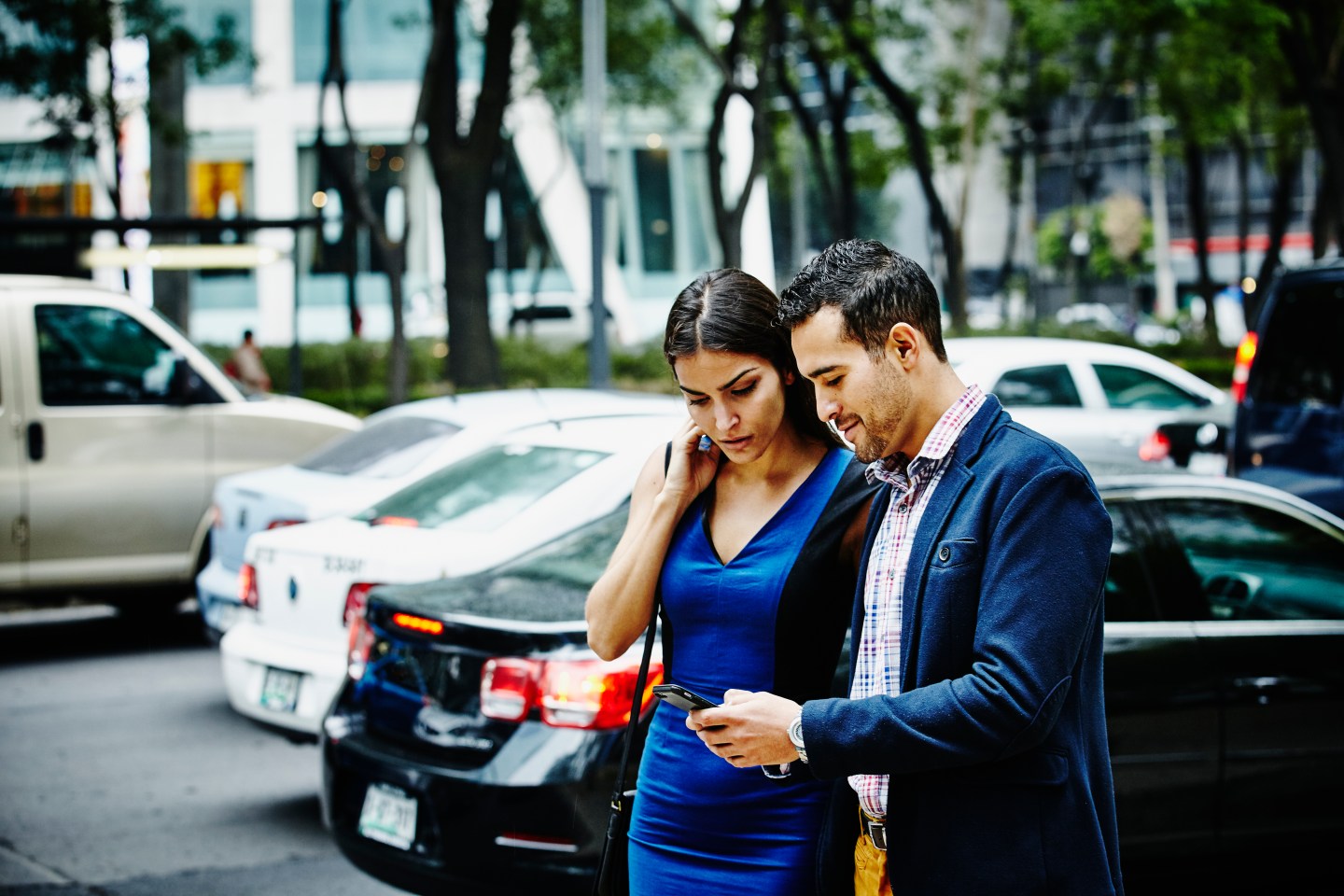 Couple looking at information on smartphone