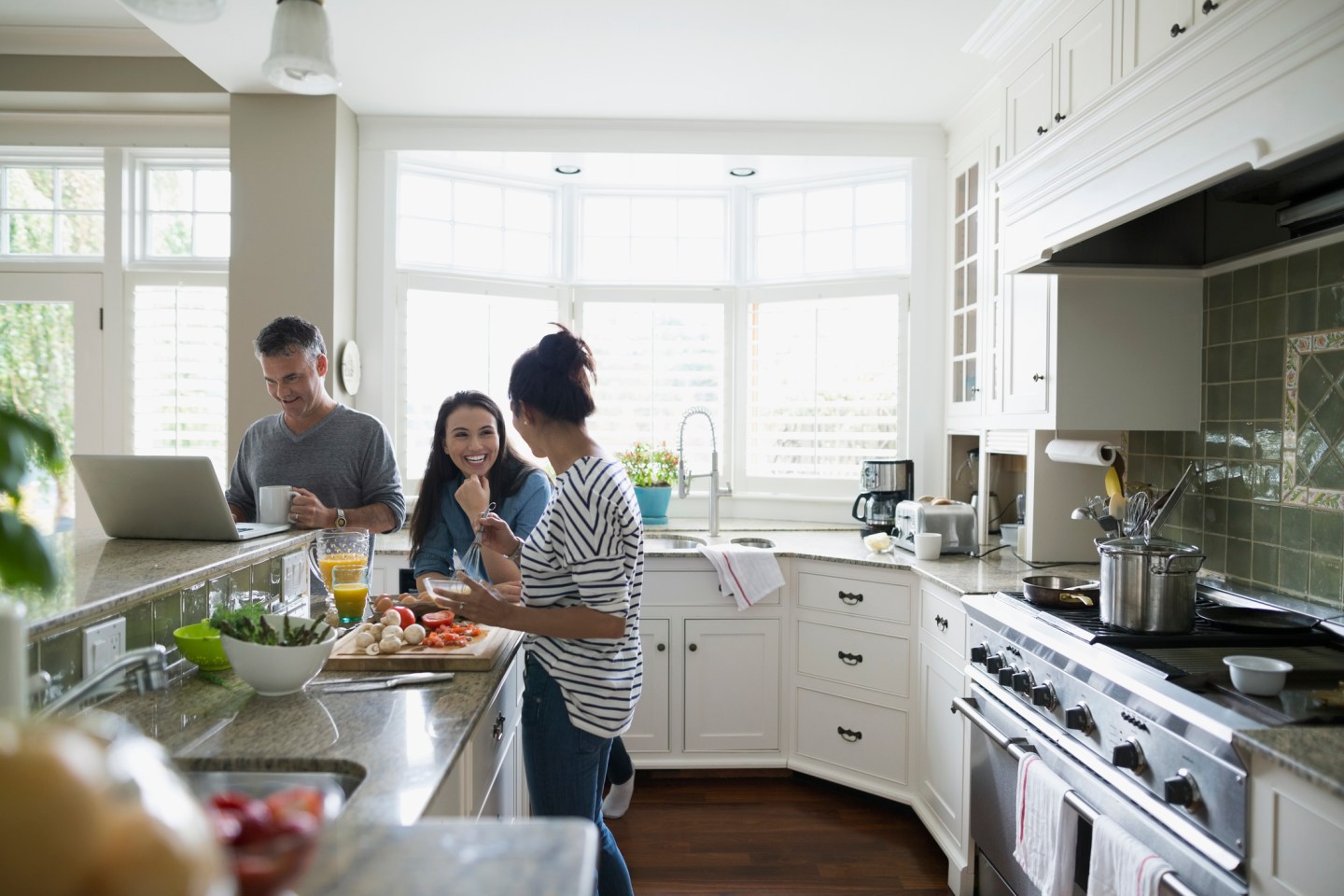 Family cooking in kitchen