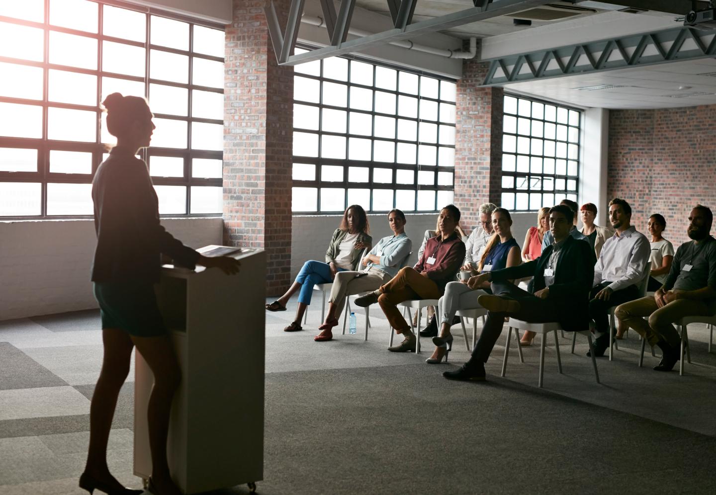 Businesswoman doing presentation in auditorium