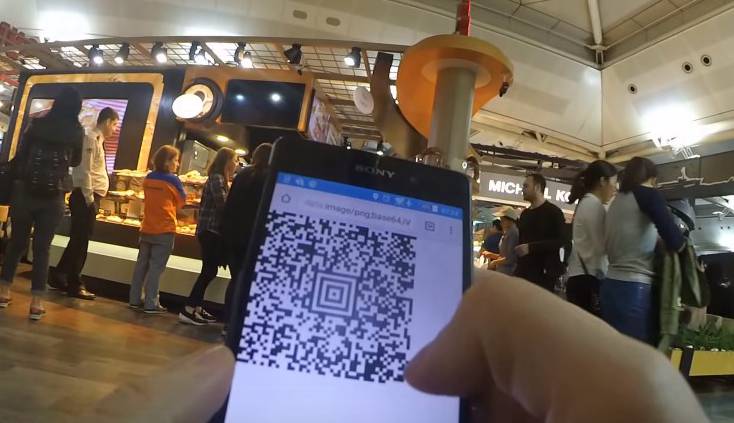 hacker showing app for generating fake airline boarding passes