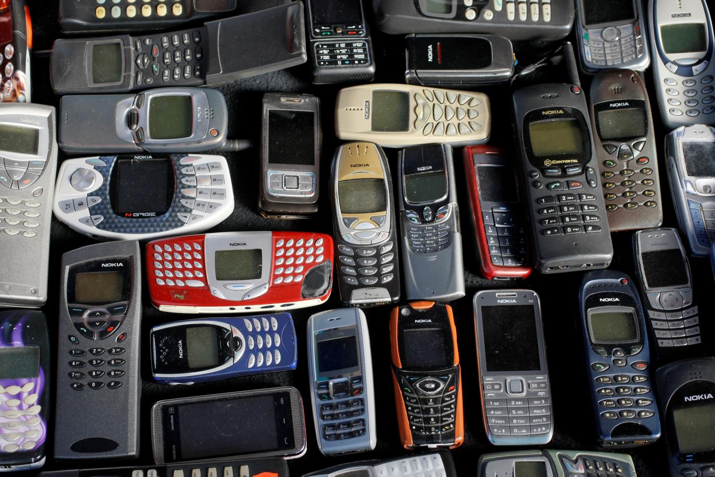 Photo illustration of a collection of mobile phones made by Nokia