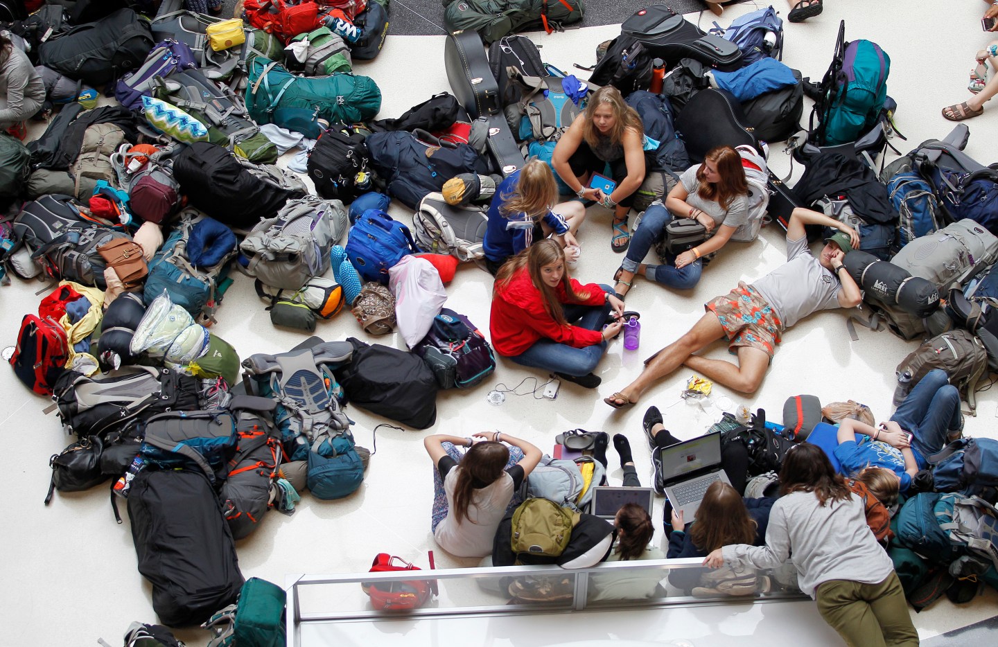 Members of the mission group Adventures In Missions wait to find out if their flight to Guatemala is on time or cancelled after Delta Air Lines' computer systems crashed at Hartsfield Jackson in Atlanta