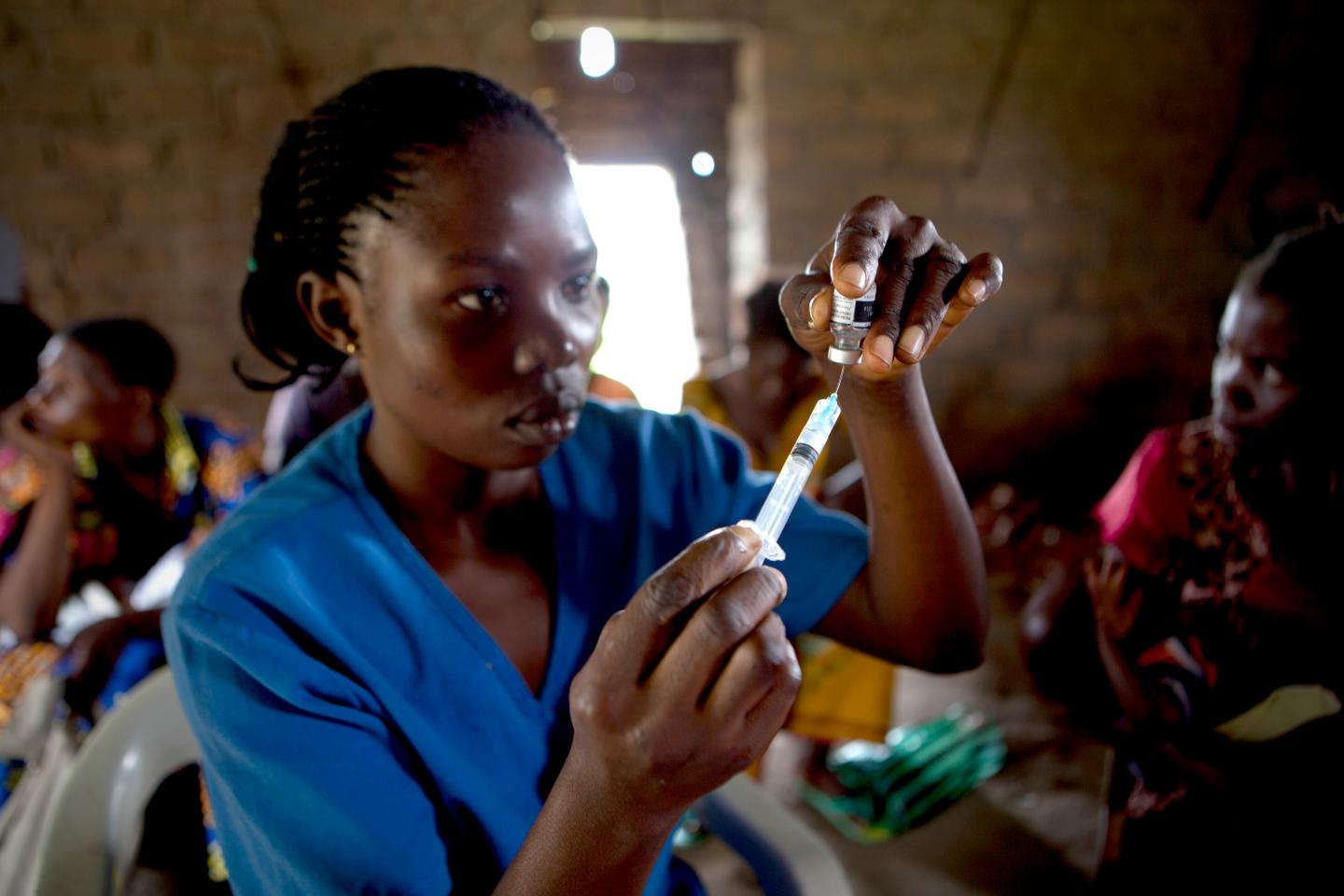 A health worker vaccinated children at Ba Kwasumba Health Centre, Cilundu Health Zone, Kasai Oriental Province, DRC. Save The Children and GSK have together successfully created a vaccination programme against preventable diseases for children under 5.GSK’s PRIME project beginning in 2014 will provide essential free medicines and equipment to under equipped Health Centres in DRC. GSK PRIME will improve access to health services through refurbishing health centers, training, equipping and supporting frontline health workers and driving a demand for health services from communities where children currently have no access to health care. DRC is one of the worst countries in the world to be a mother or a child. One in five children die of preventable diseases before reaching their 5th birthday. PRIME will contribute to the wider Save The Children Health Signature Programme in DRC.