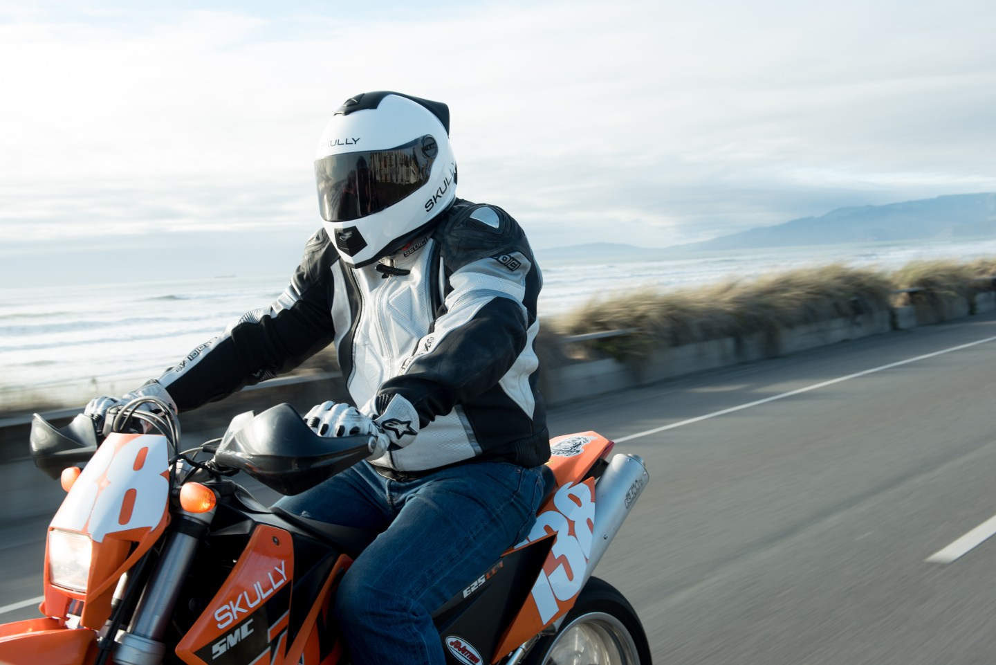 motorcycle rider wearing skully hud helmet