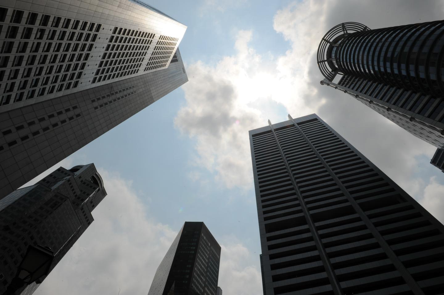 Clouds shade over the banking buildings