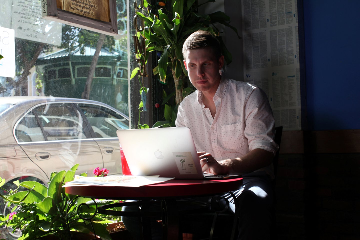 Reuters journalist Nick Brown works at his laptop at a cafe in San Juan