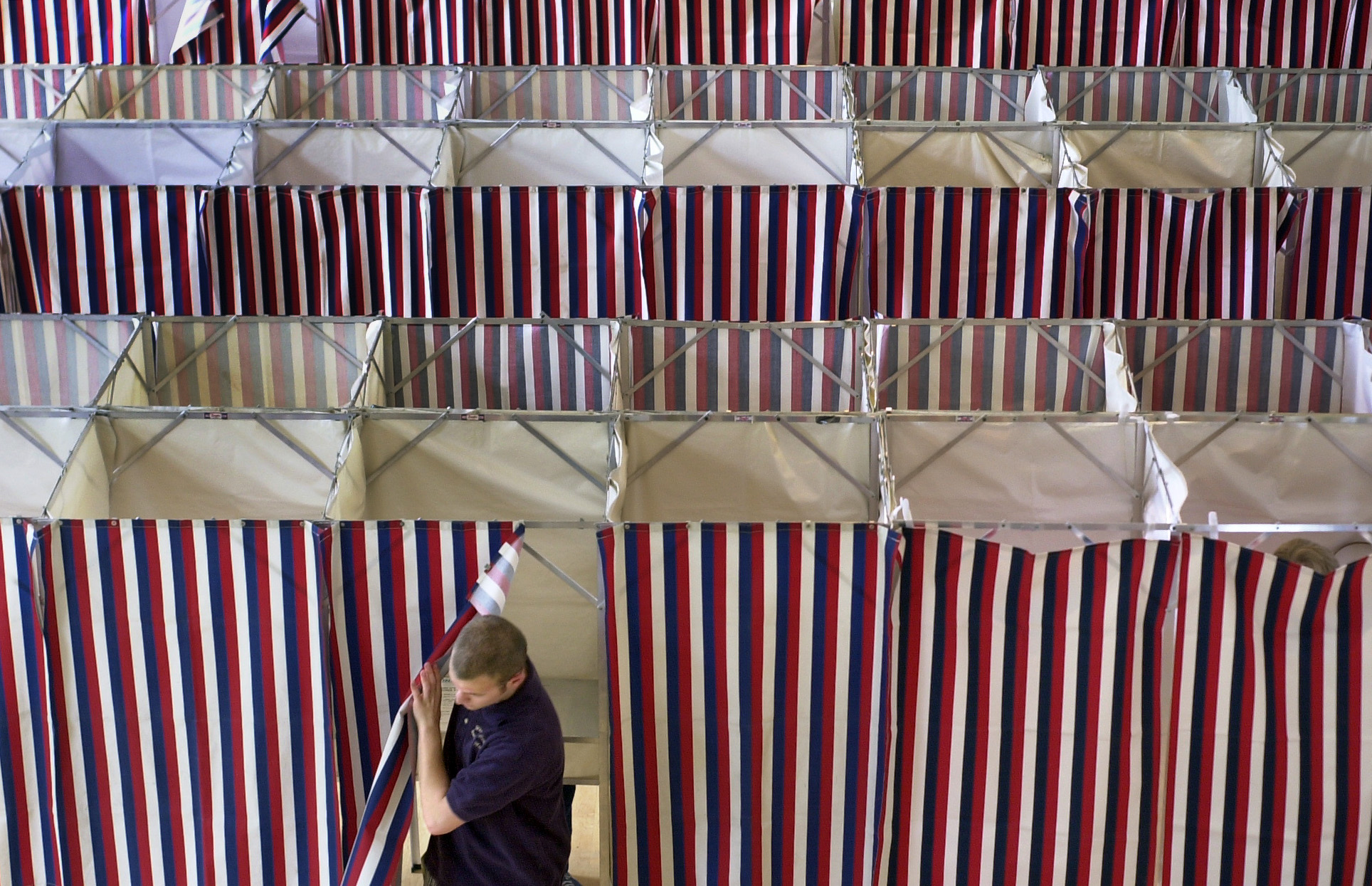 A man leaves a booth after voting at Kennebunk Town Hall on Tuesday. In addition to the state primar