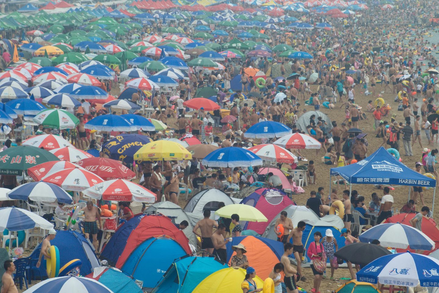 Crowds Cool Off At Fujiazhuang Beach In Dalian