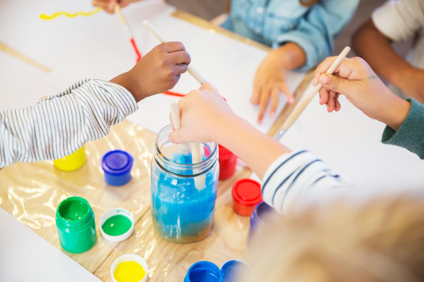 Students painting in class