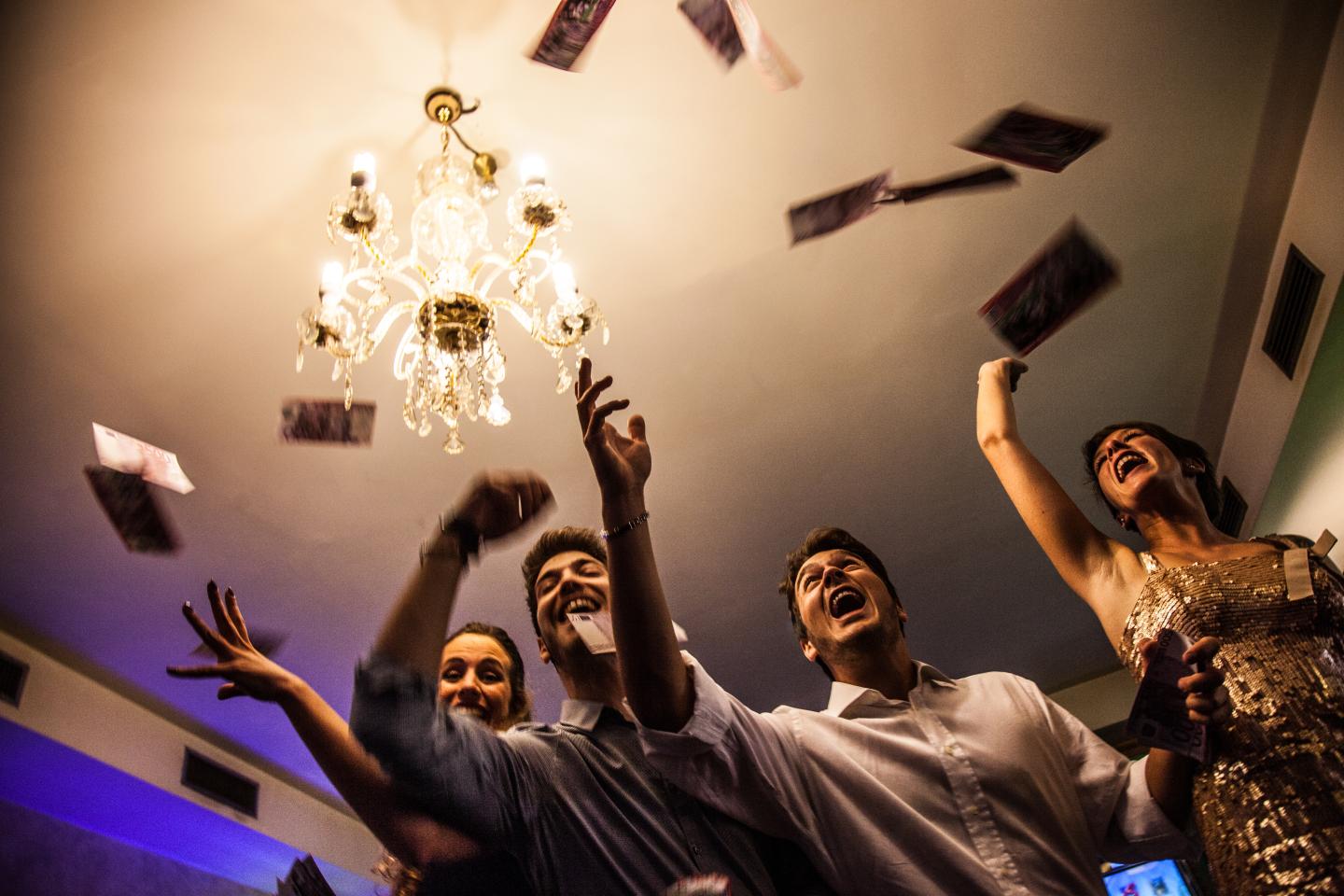 Friends having fun with money in the casino