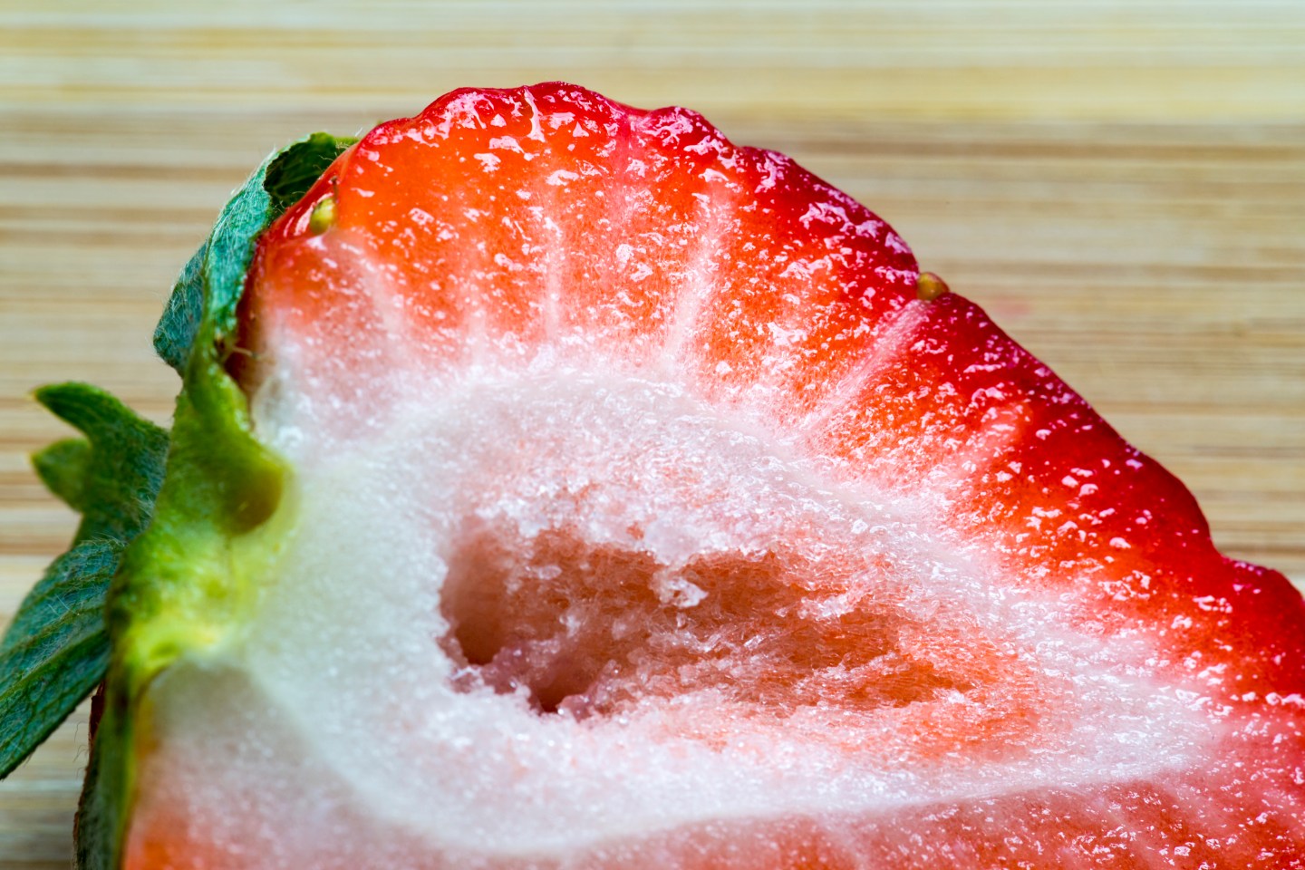 Strawberry close up: Fruit cut in half. The garden