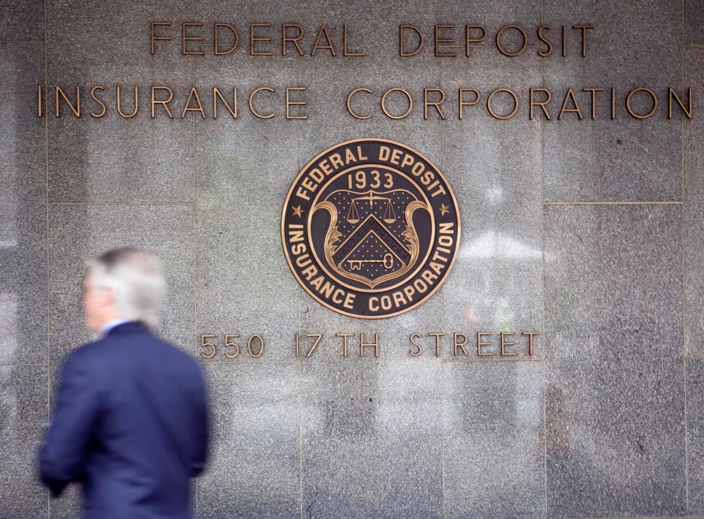 A pedestrian walks outside the headquarters of the U.S. Fede