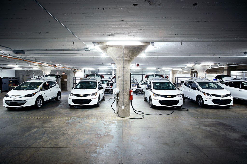 Electric-powered Chevrolet Bolts in Cruise Automation’s San Francisco garage. Cruise is working with GM to add autonomous-driving technology to the Bolt.
