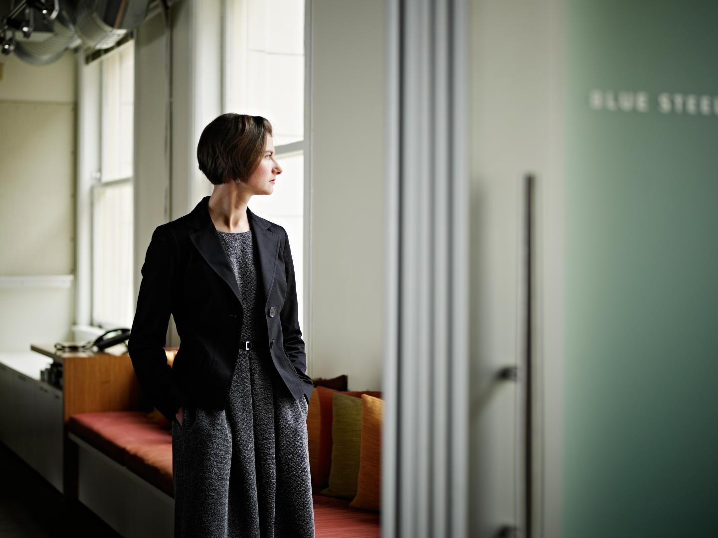 Businesswoman standing in office conference room