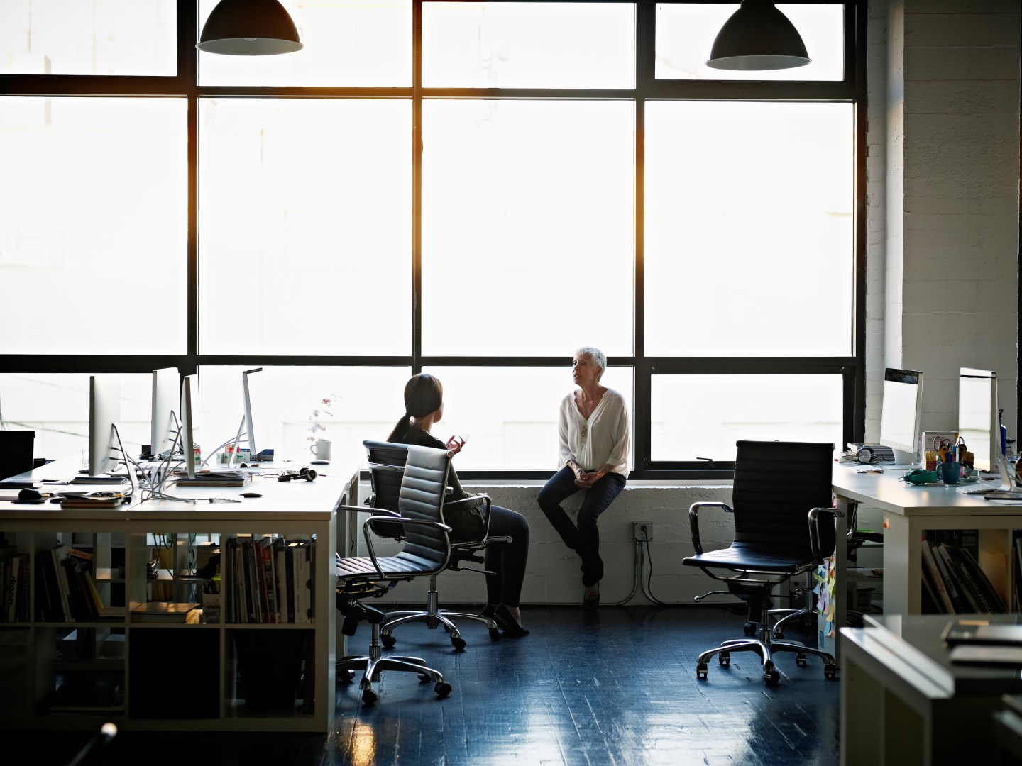 Businesswomen sitting in discussion in office