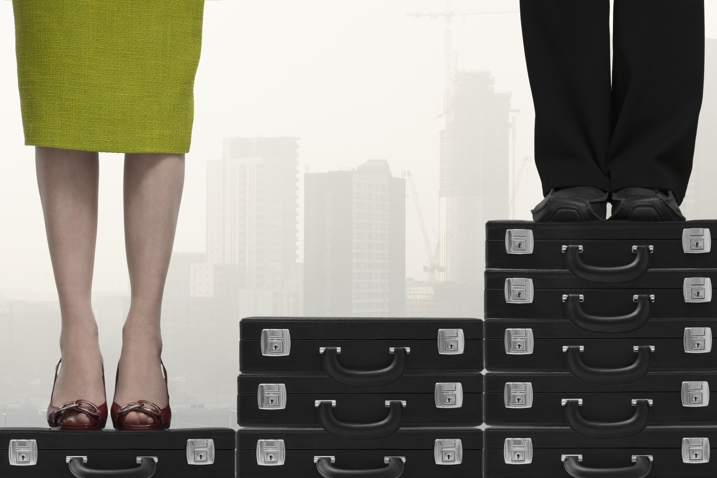 Business man higher up stairs than business woman