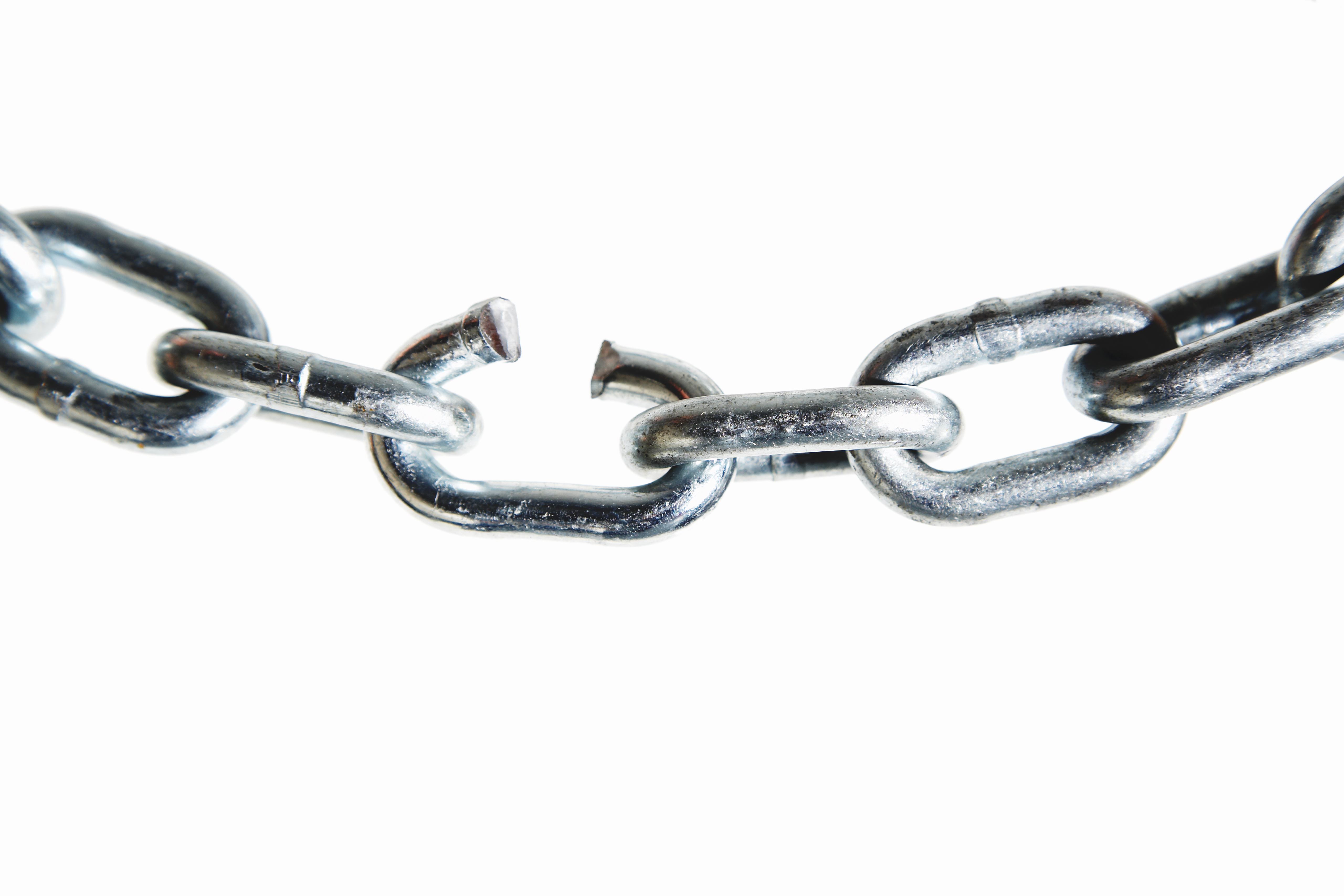 Broken link in metal chain, close-up