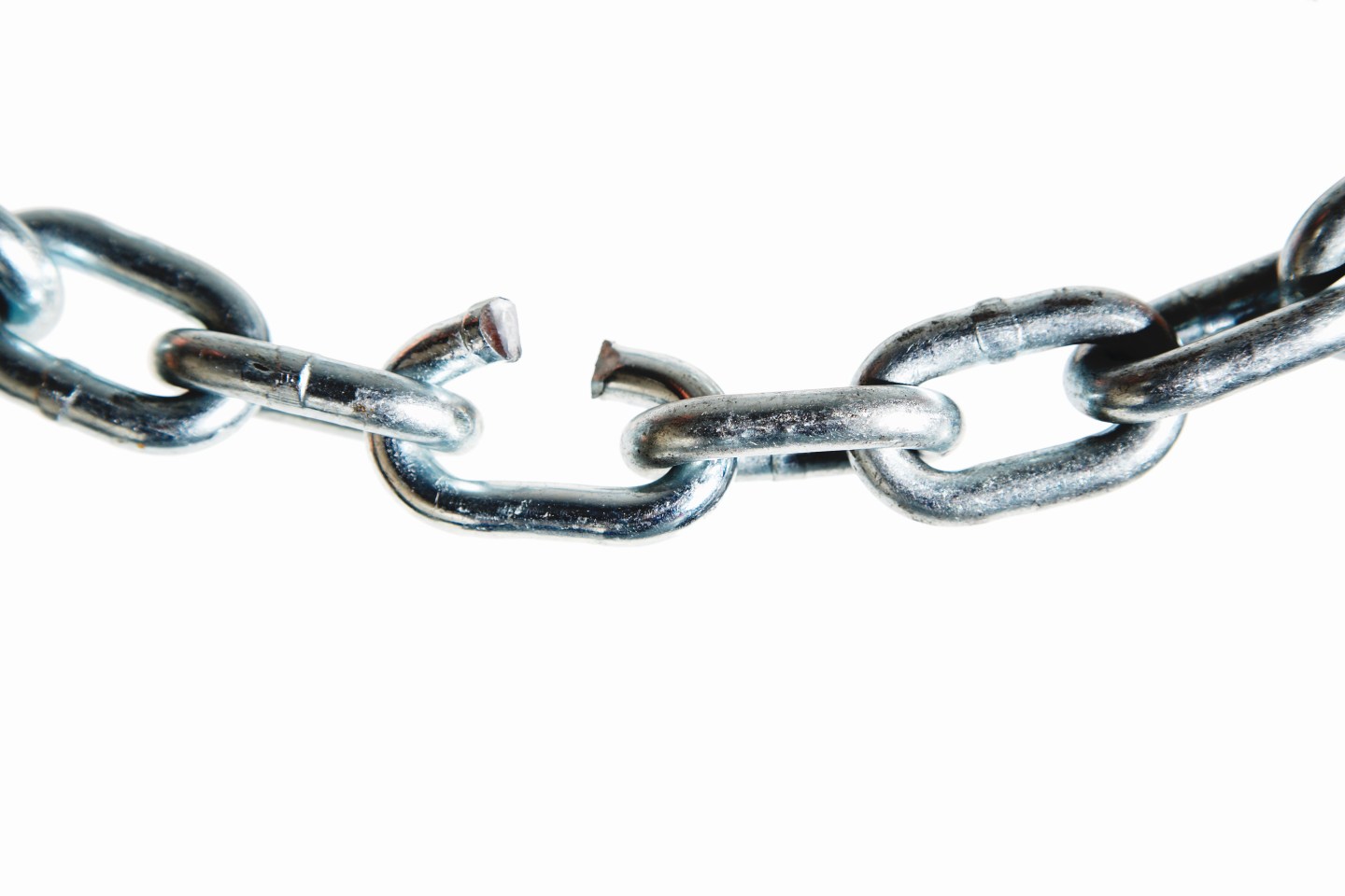 Broken link in metal chain, close-up