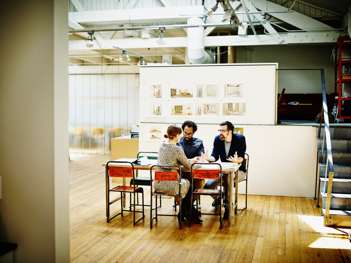 Architects discussing project in office